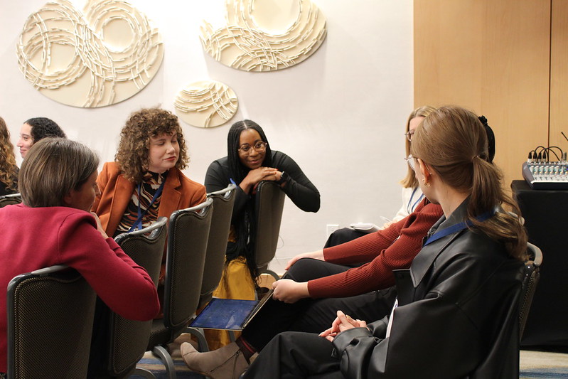 Image of six Emerging Leaders sitting together in discussion.